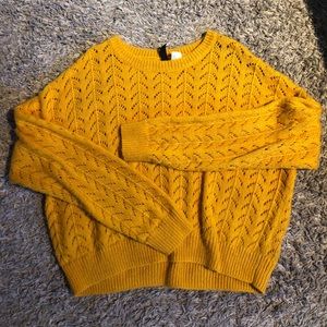 Bright yellow scallop knitted sweater.